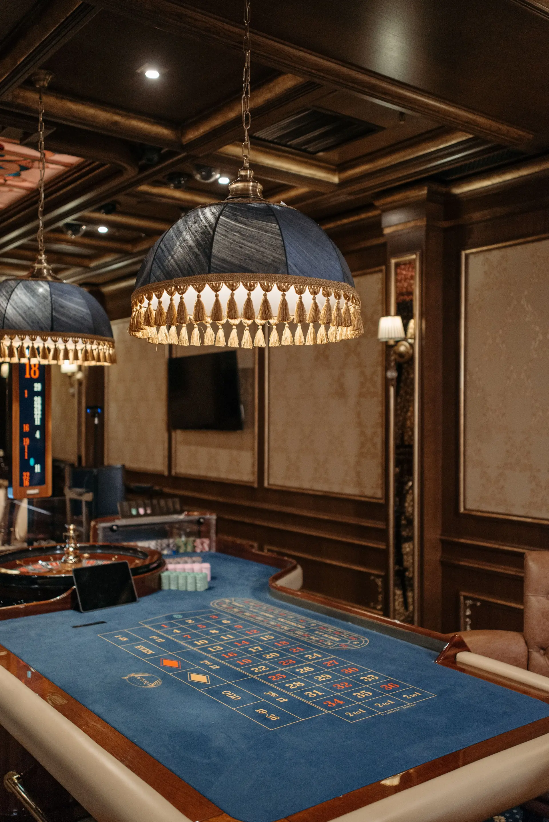 Elegant casino roulette table under soft lighting